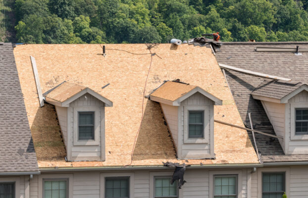 Pros and Cons of Re-Roofing vs. Roof Replacement